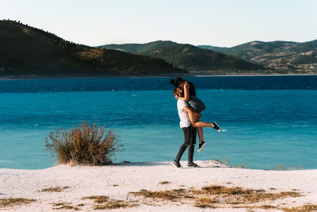 Couple in love on the beach. Honeymoon lovers. Man and woman on the island